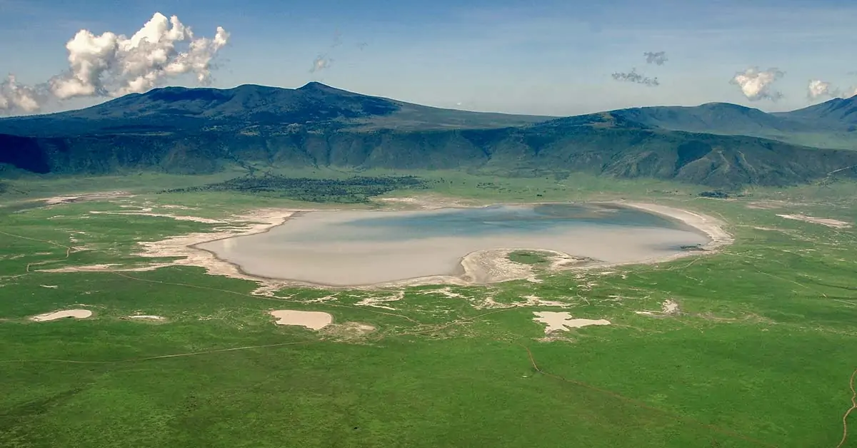 Safari lodge overlooking Ngorongoro Crater rim with breathtaking morning views and misty landscapes below