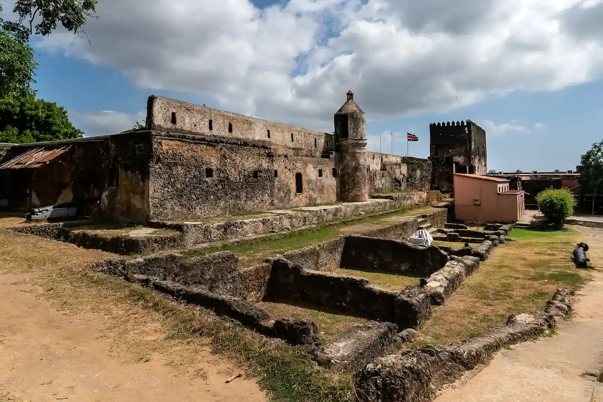 Weathered bastion walls of Fort Jesus Mombasa against a bright coastal sky