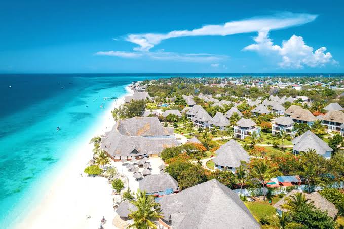Luxury beachfront resort overlooking Zanzibar coastline with crystal clear ocean and relaxing tropical scenery.