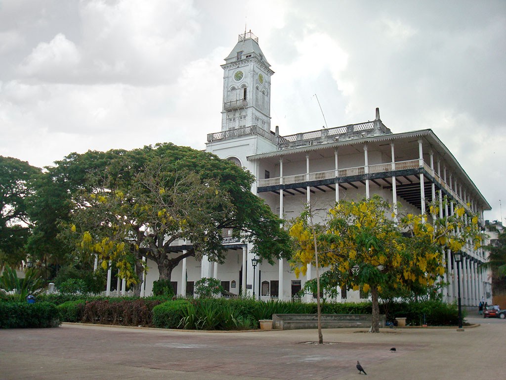 Historic House of Wonders overlooking Stone Town waterfront with elegant balconies exterior.