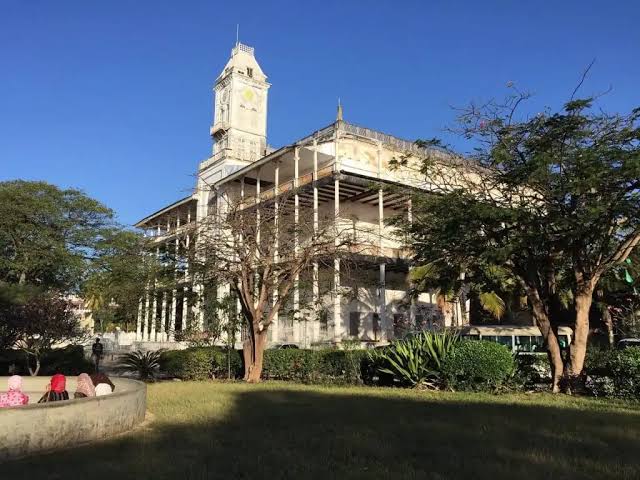 Historic House of Wonders overlooking Stone Town waterfront with elegant balconies and towering columns beautifully.