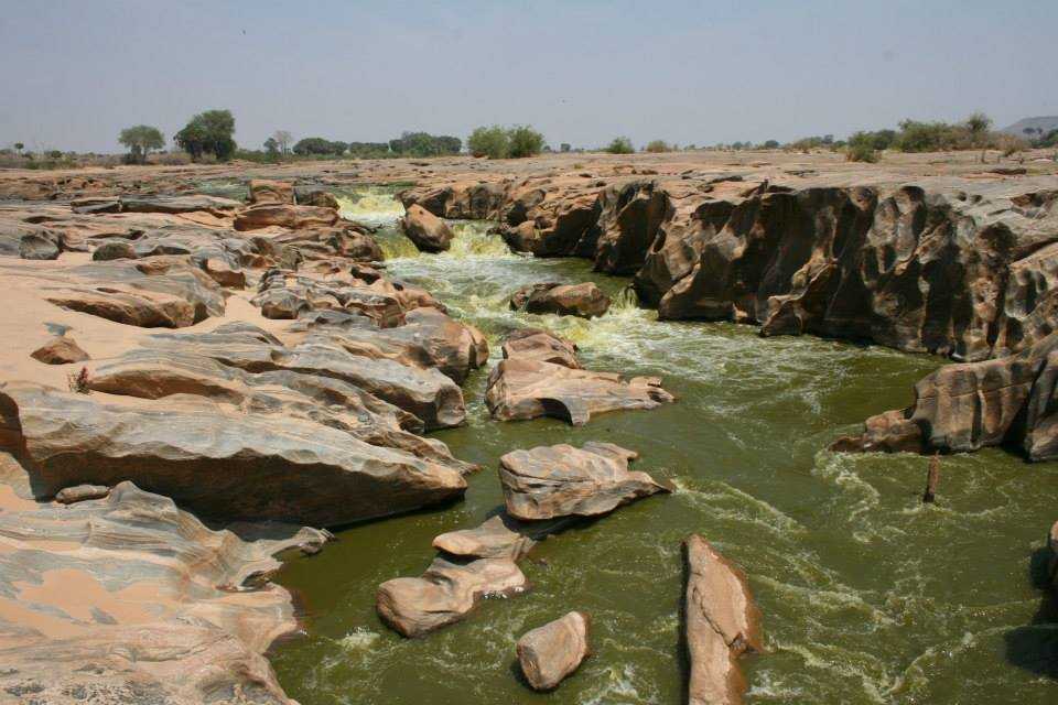 Galana River rushing through carved rocks at Lugard Falls inside Tsavo East National Park