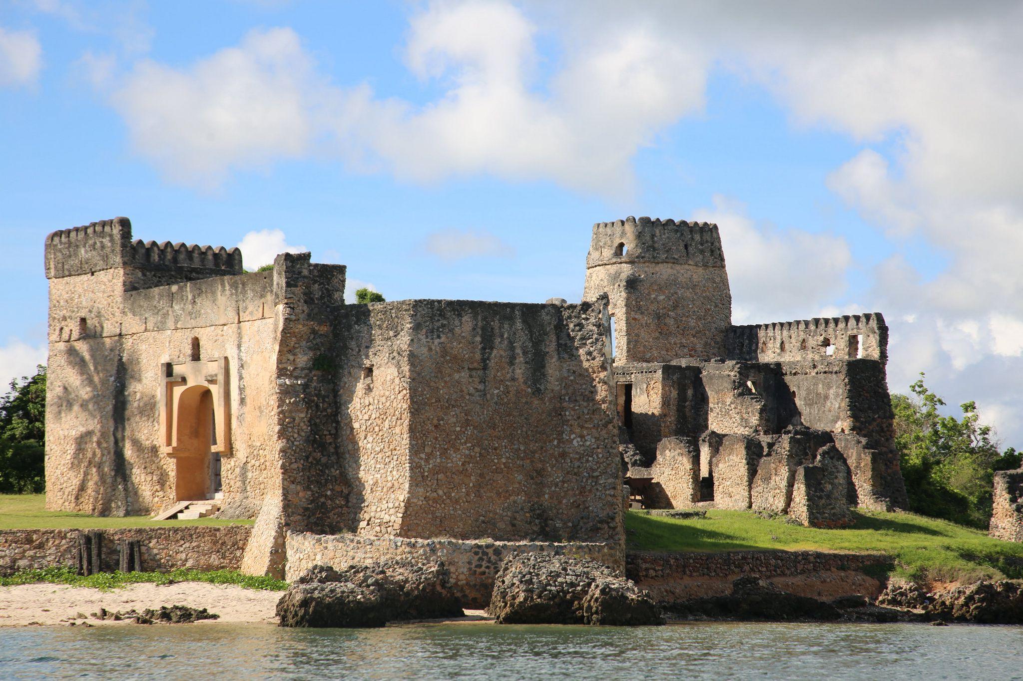 Historic coral stone mosque ruins on Kilwa Kisiwani overlooking Indian Ocean coastline