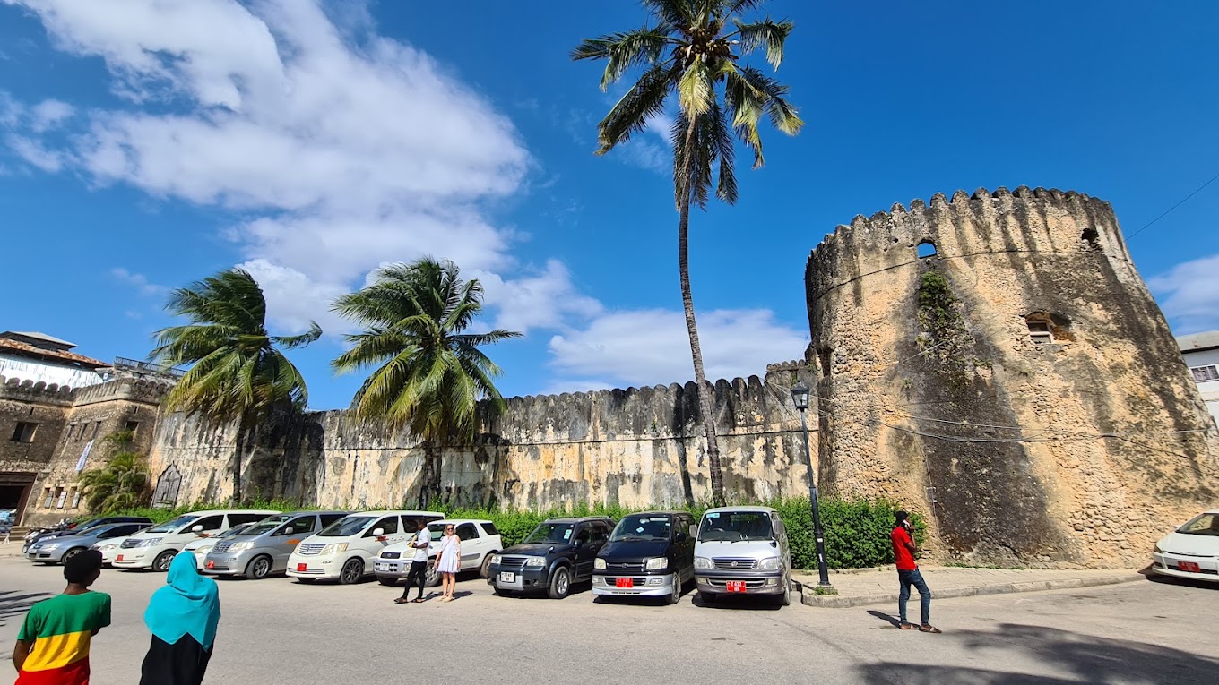 Historic courtyard inside Zanzibar Old Fort featuring traditional architecture, artisan shops, and cultural performances daily
